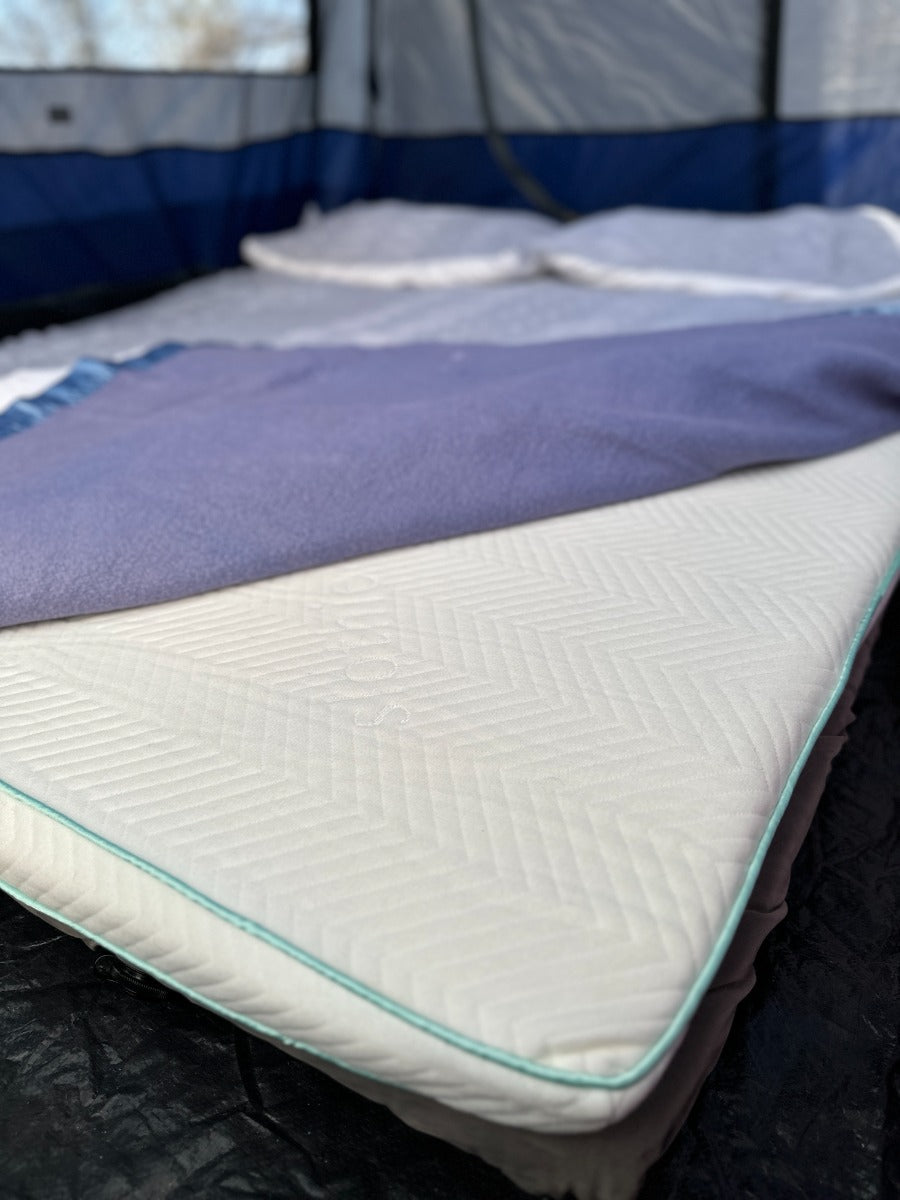 A mattress topper with a cover