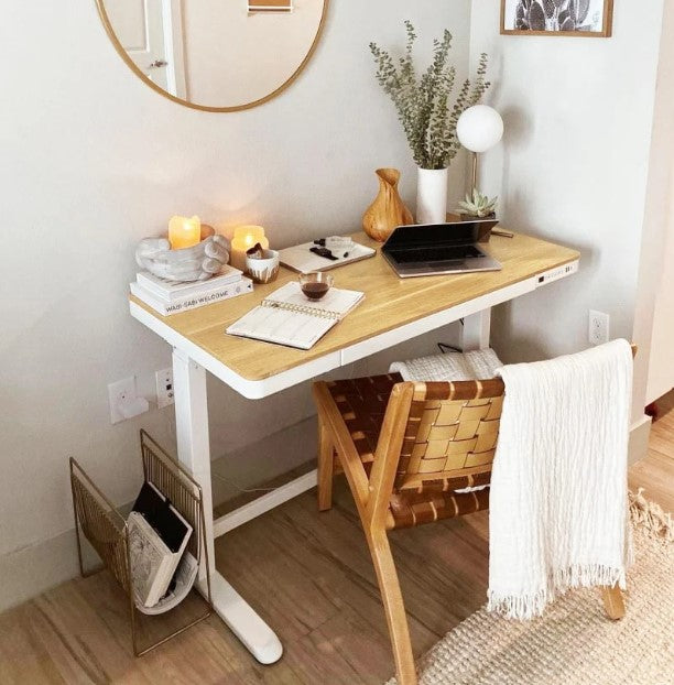 Adjustable desk in a corner